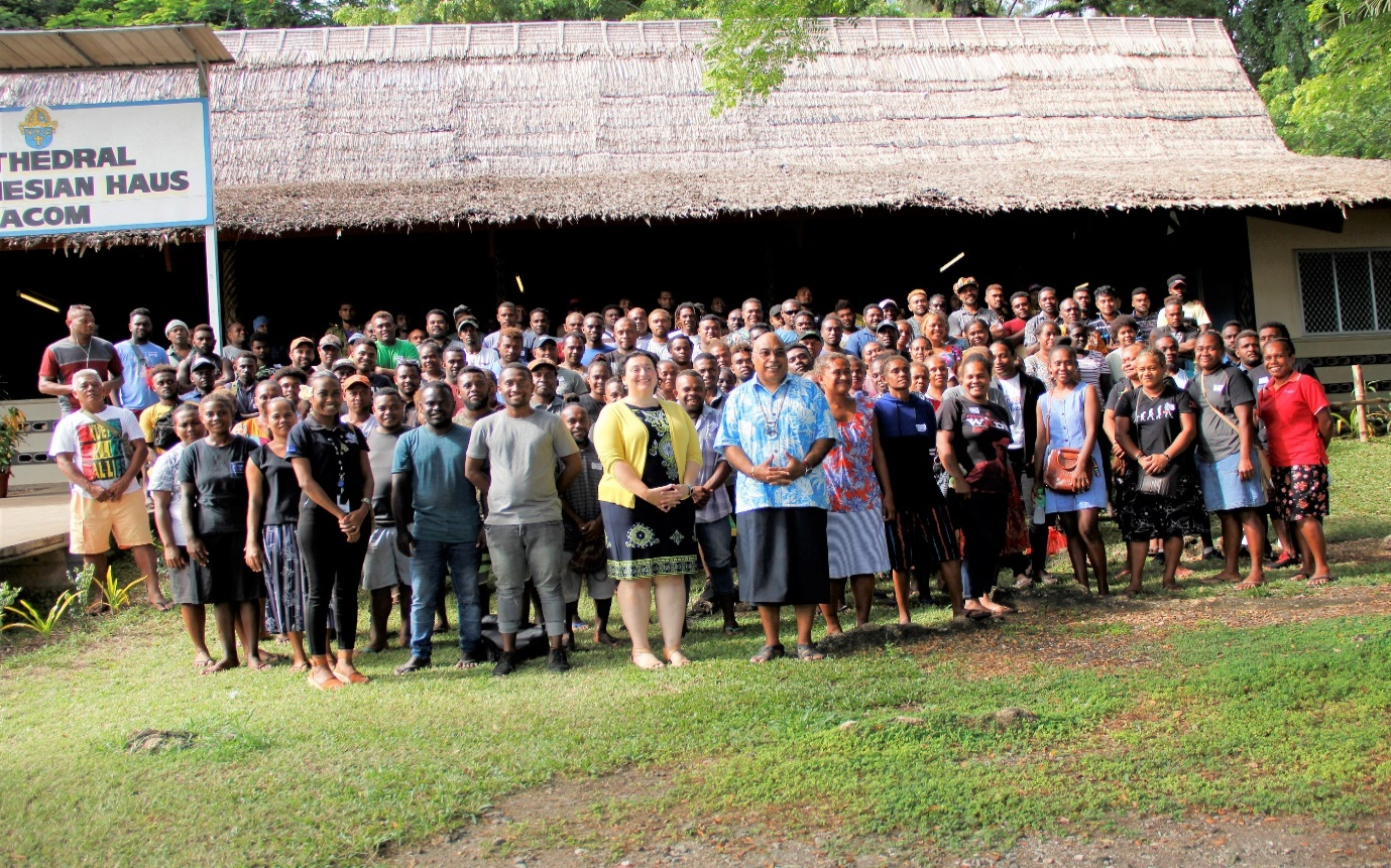 PS Beck and Christina & Vanessa from AHC with the workers after the Pre-departure briefing at St. Barnabas Leaf hut.