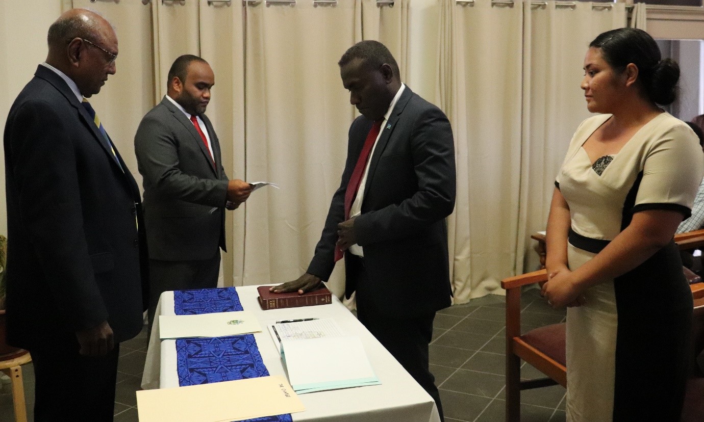 Solomon Islands Ambassador and Permanent Representative to the United Nations Office in Geneva and the World Trade Organisation H.E Salato taking his oath before the Minister of Foreign Affairs and External Trade Hon Milner Tozaka. 
