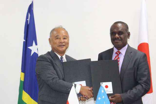 Hon. Jeremiah Manele exchanges signed notes with Japan Embassy’s Chargé D'affaires Junji Yamazaki