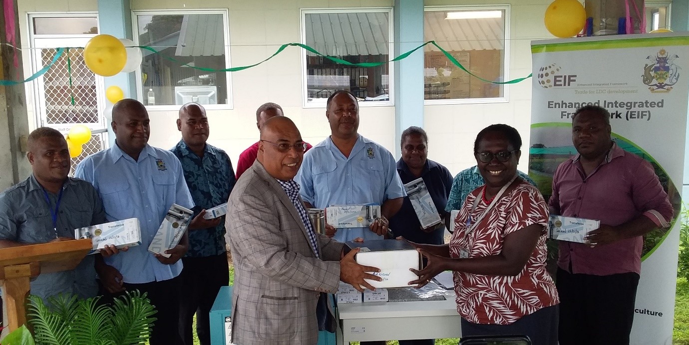 Permanent Secretary for MFAET Mr. Collin Beck handing over the lab equipment’s to the PS for MHMS Mrs. Pauline McNeil