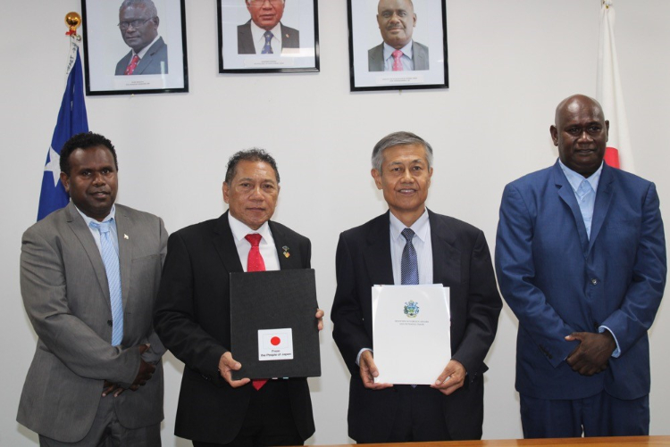 Supervising Minister of Foreign Affairs and External Trade, Hon. Peter Shanel Agovaka after the signing of the Exchange Note with the Ambassador of Japan to the Solomon Islands, H.E. MIWA Yoshiaki. Also in attendance is Supervising Permanent Secretary of the Ministry of Foreign Affairs and External Trade, Cornelius Walegerea and Permanent Secretary of the Ministry of Forestry and Research, Dr. Vaeno Vigulu.