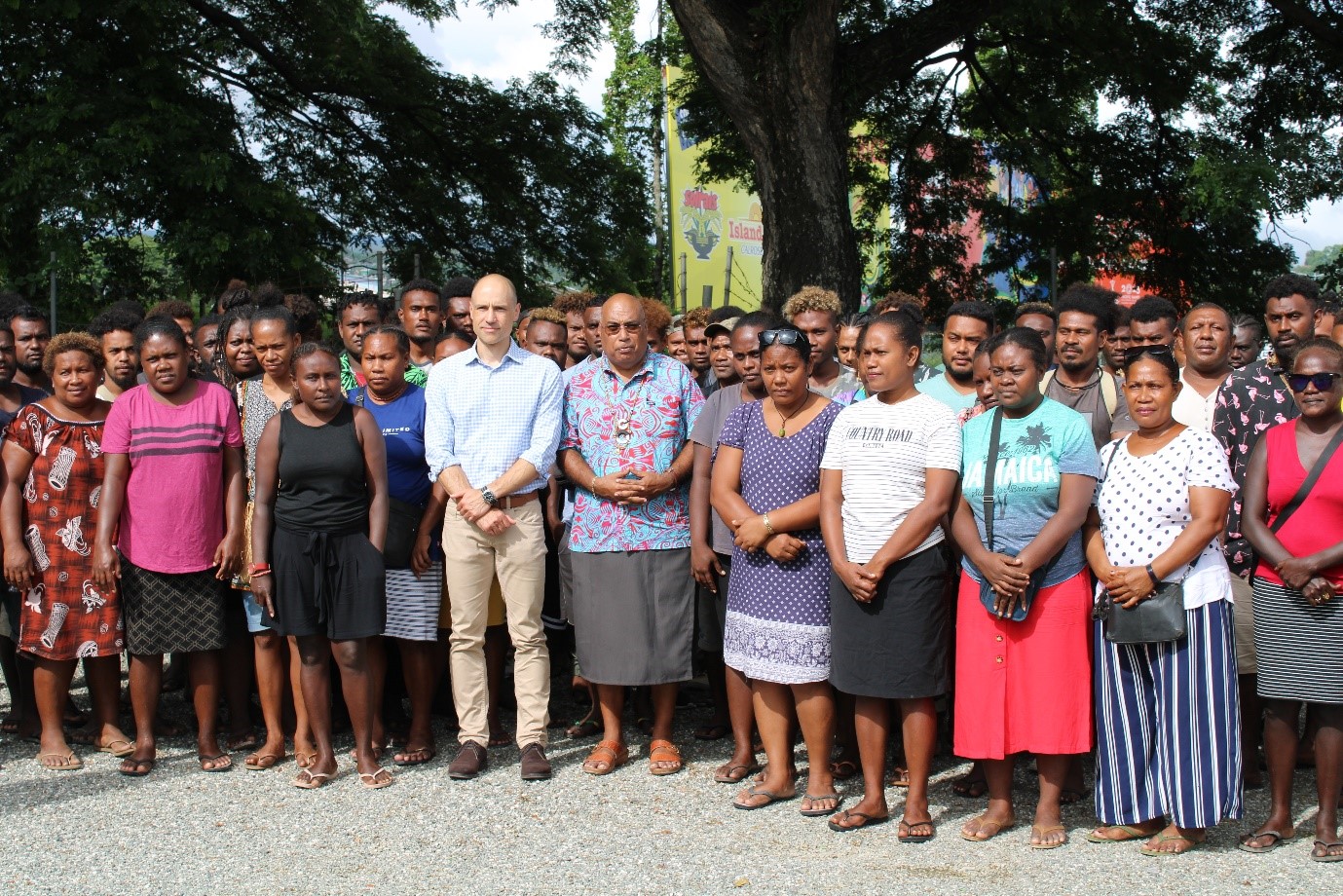 Permanent Secretary of the Ministry of Foreign Affairs and External Trade, Collin Beck and Australia’s Deputy High Commissioner to Solomon Islands, Andrew Schloeffel with the 88 workers who will be travelling to work in Australia soon.